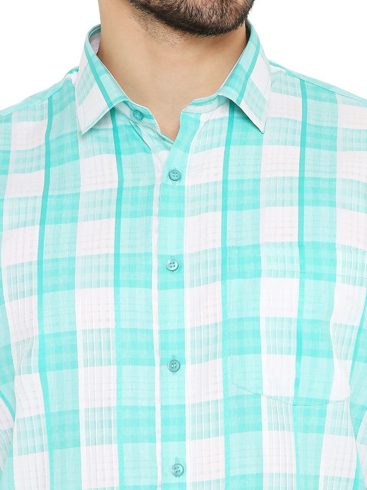 Close-up of green checkered slim fit shirt collar and buttons, emphasizing fine detailing and breathable cotton fabric.