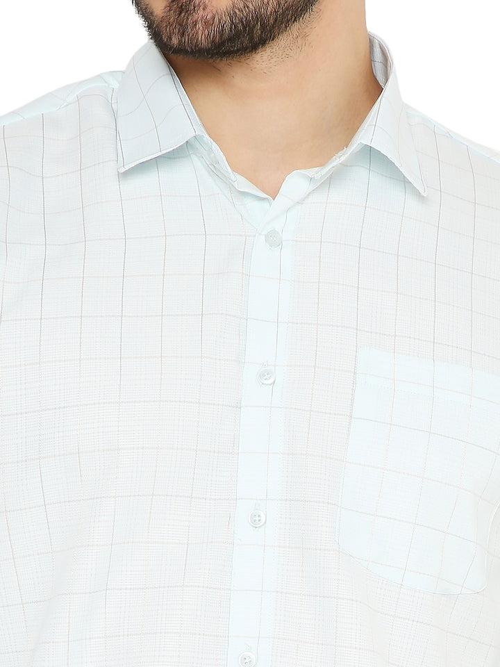 Close-up of Slim Fit Checkered Shirt - Light Blue showing fine check pattern and soft fabric texture. Features a chest pocket and classic collar.