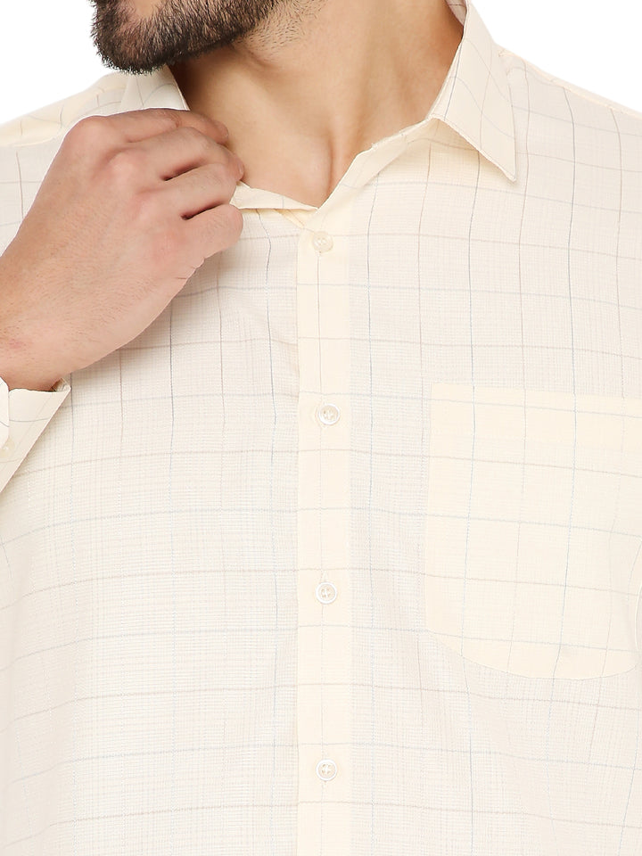 Close-up of Slim Fit Checkered Shirt's collar and chest pocket, highlighting soft fabric texture and fine grid pattern.