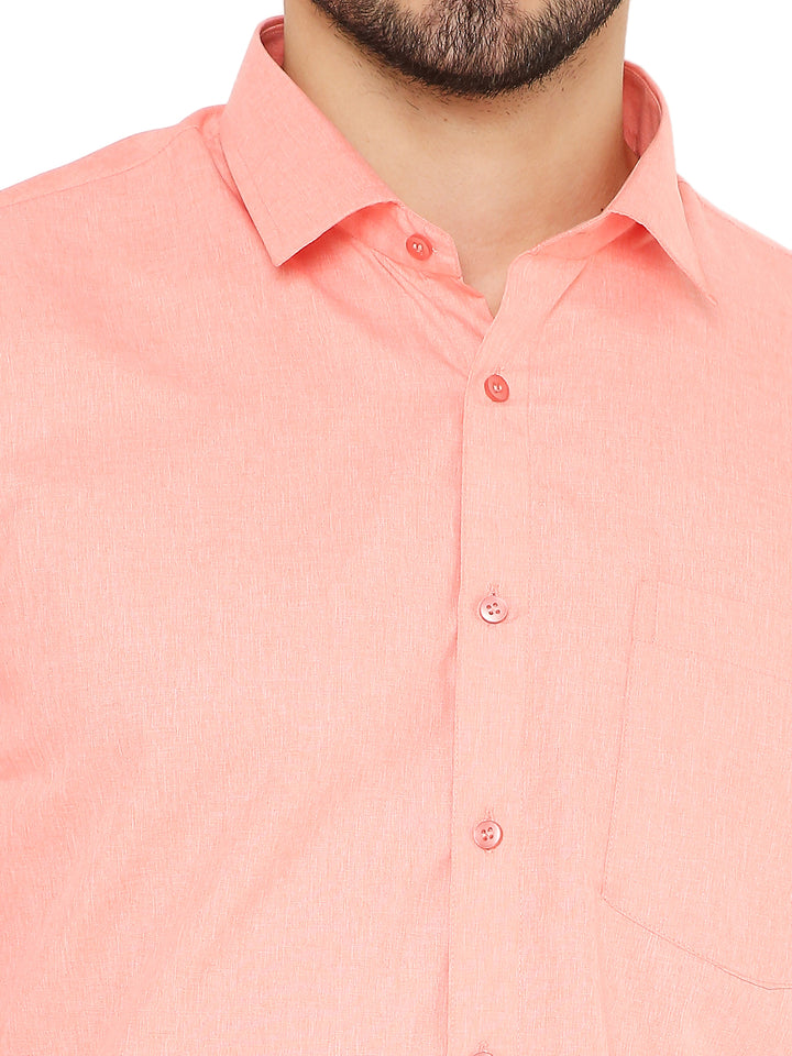 Close-up of slim fit peach shirt for men showing fine stitching, soft fabric texture, and front button details for a polished look.