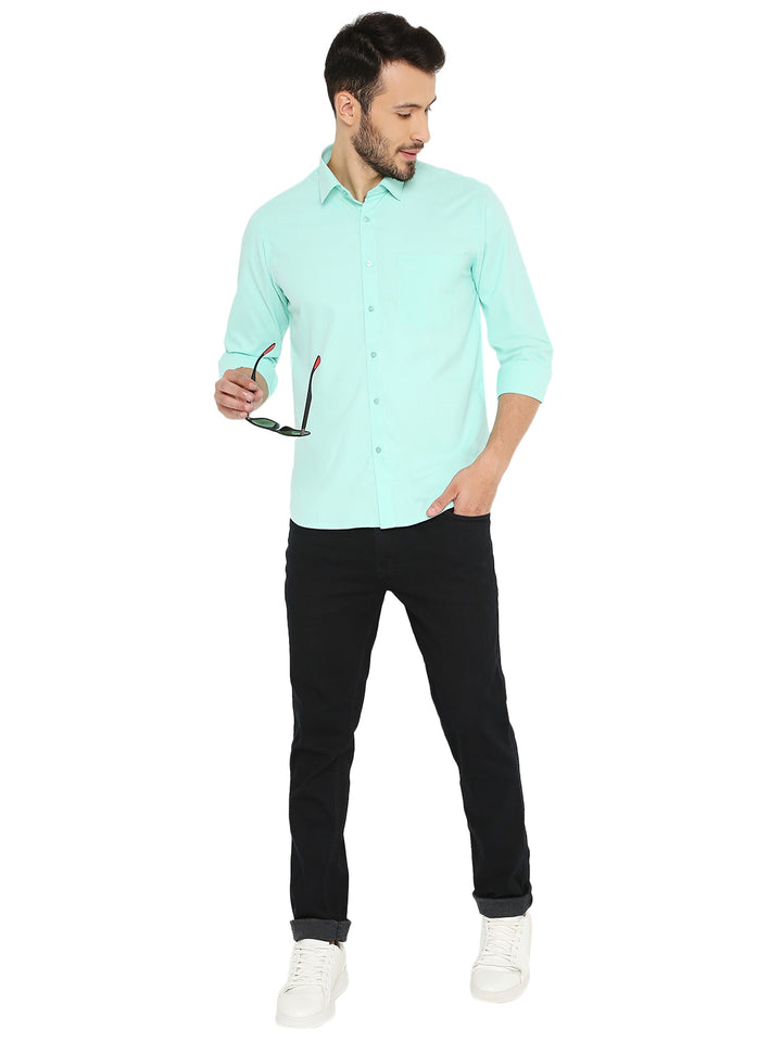 Full outfit view of slim fit bright green shirt paired with black pants and white sneakers. A trendy, breathable look for everyday style.
